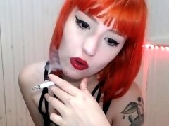 Redhead smoking cigarettes