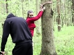 Amateur brunette teen gets her ass spanked hard in the woods