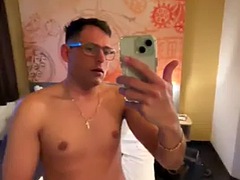 Sweet German guy masturbates early in the morning in the hotel room and cums on the bed