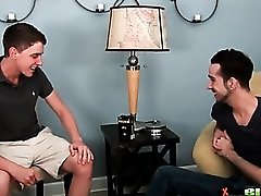 Two guys stroke their dicks in gay porn