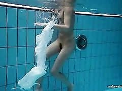 Athletic young lady goes for a naked swim